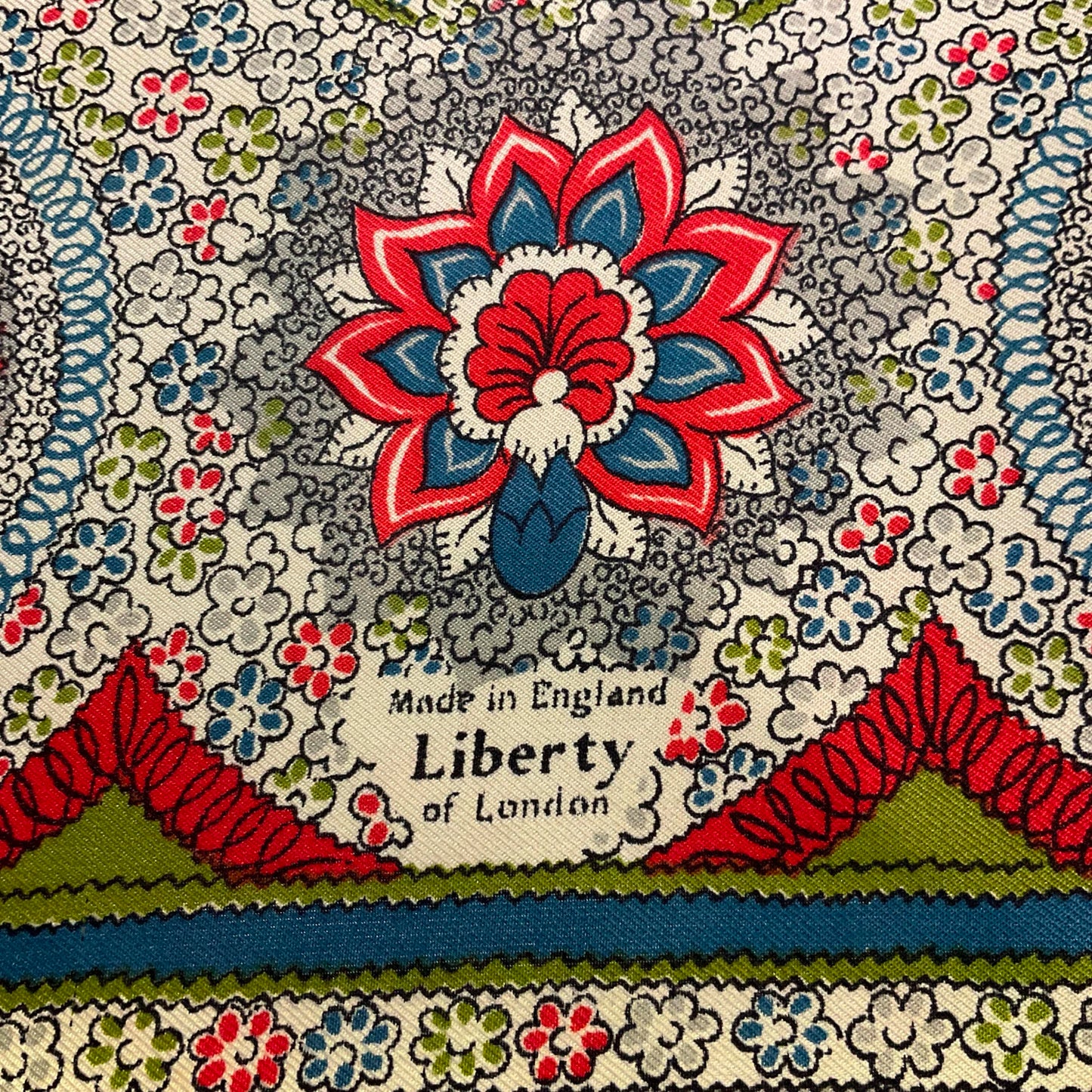 Vintage 1950s/60s pure silk geometric Paisley scarf, coral, blue, green and grey onto a pale cream background, made in England.
