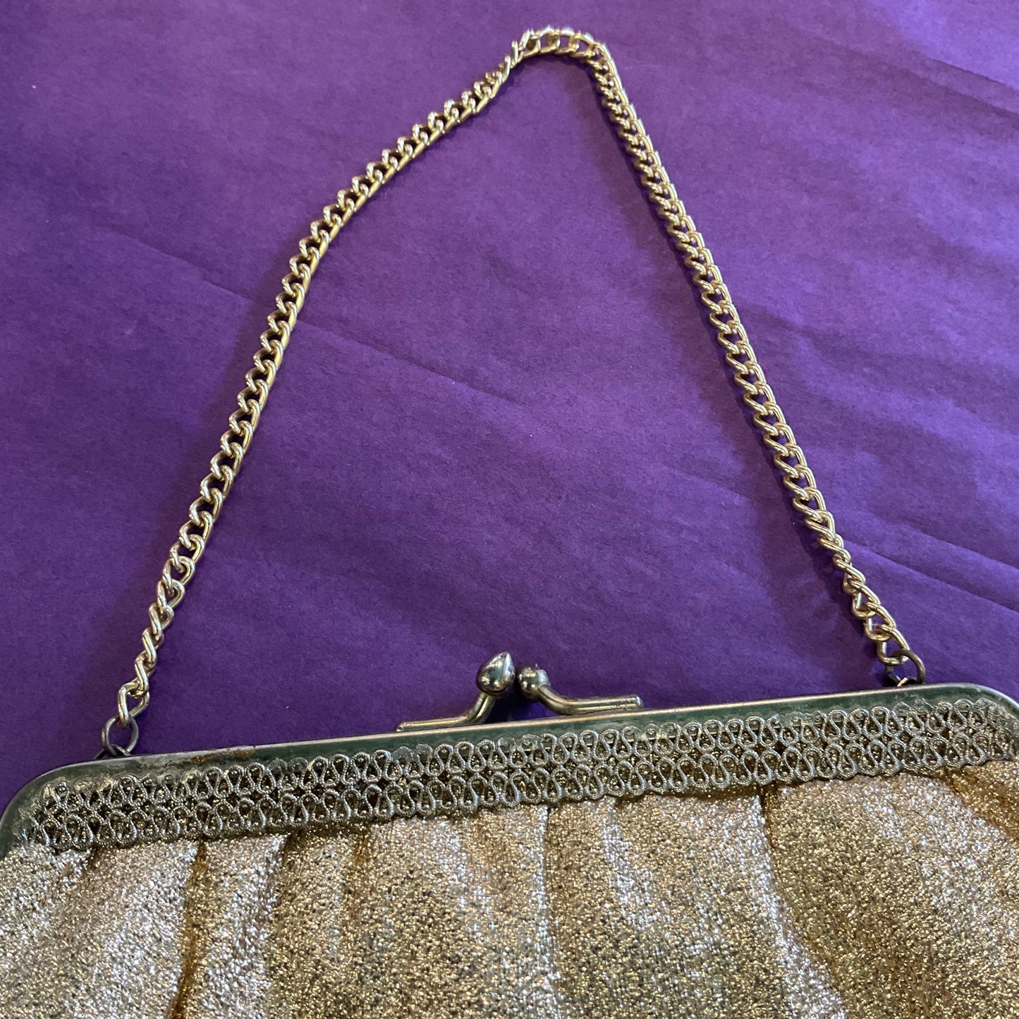 Vintage 1960s sparkling gold Lurex cocktail bag.