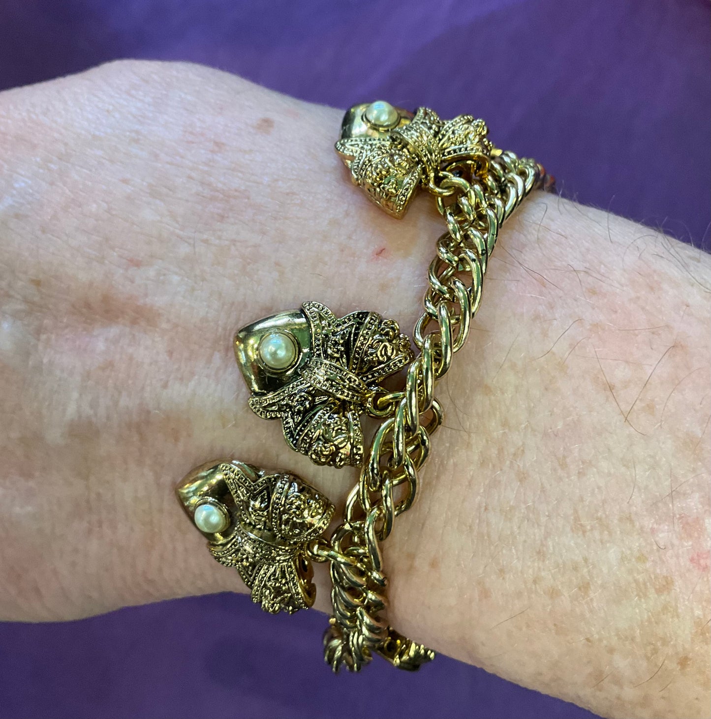 Vintage Butler and Wilson statement Gold tone and Faux Bow with Heart Charm Bracelet, signed