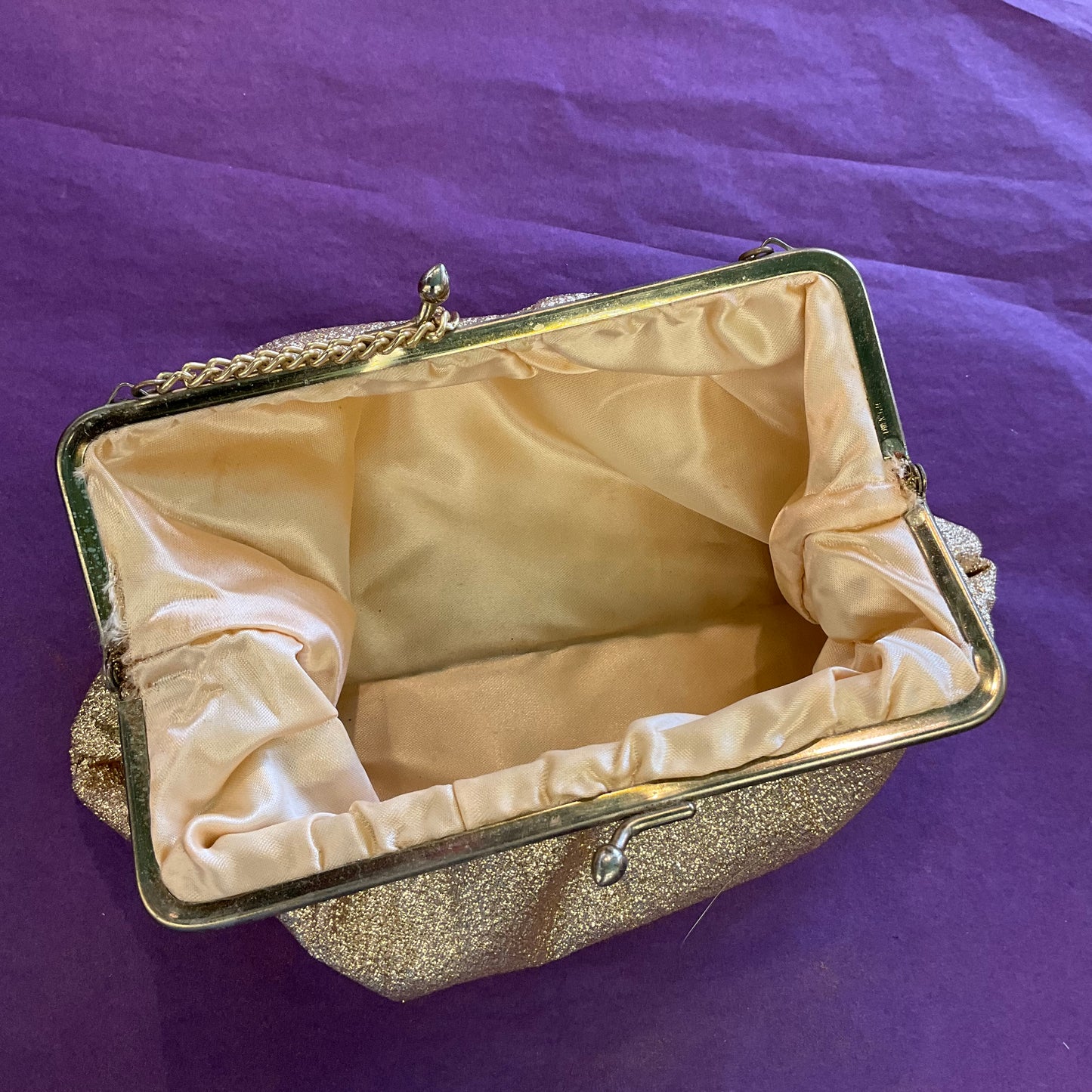 Vintage 1960s sparkling gold Lurex cocktail bag.