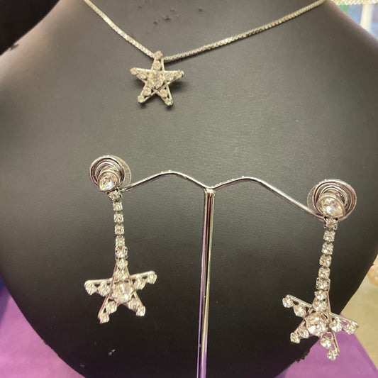 Vintage, Swarovski, rhodium plated silver and rhinestone crystal star pendant and matching drop earrings.