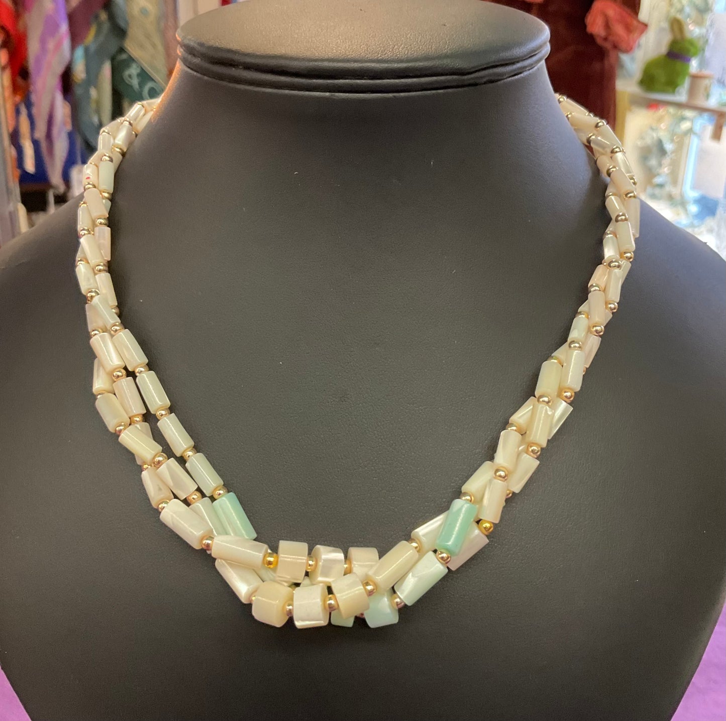 Vintage Mother of pearl twisted beaded necklace with pale aqua centre. prom, wedding.