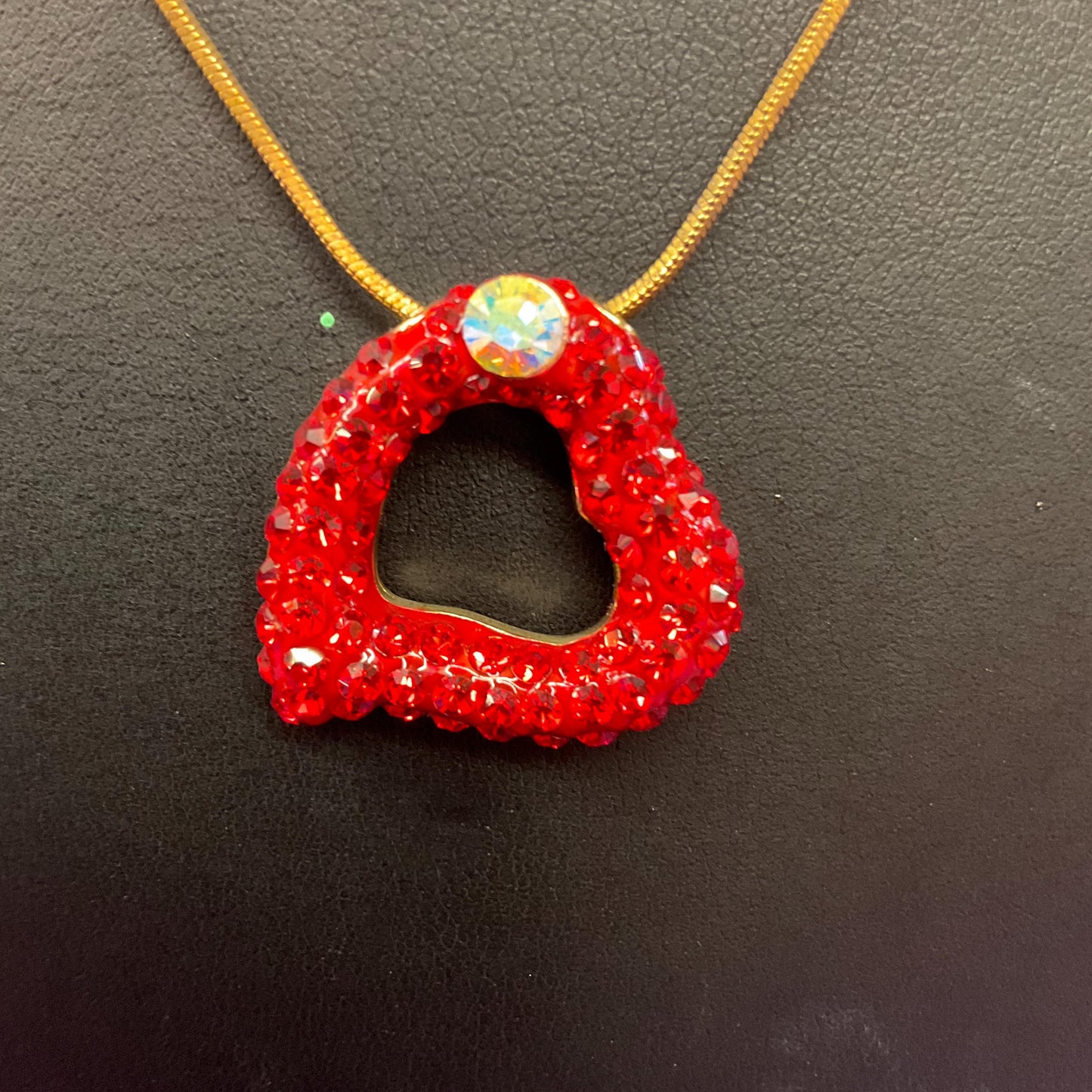 Vintage Butler and Wilson Red Crystal Asymetrical Heart Pendant, gold tone with red rhinestones and Aurora Borealis Crystal