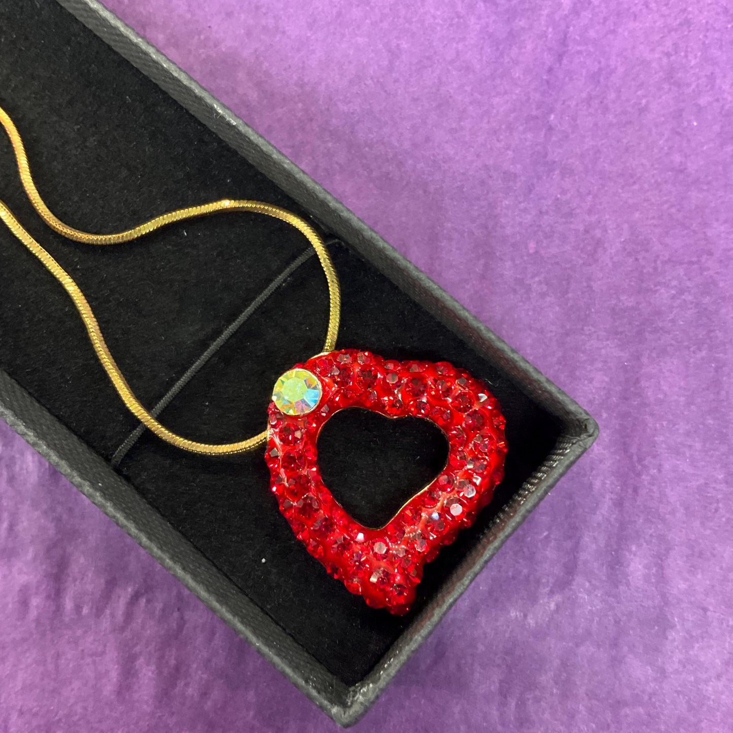 Vintage Butler and Wilson Red Crystal Asymetrical Heart Pendant, gold tone with red rhinestones and Aurora Borealis Crystal