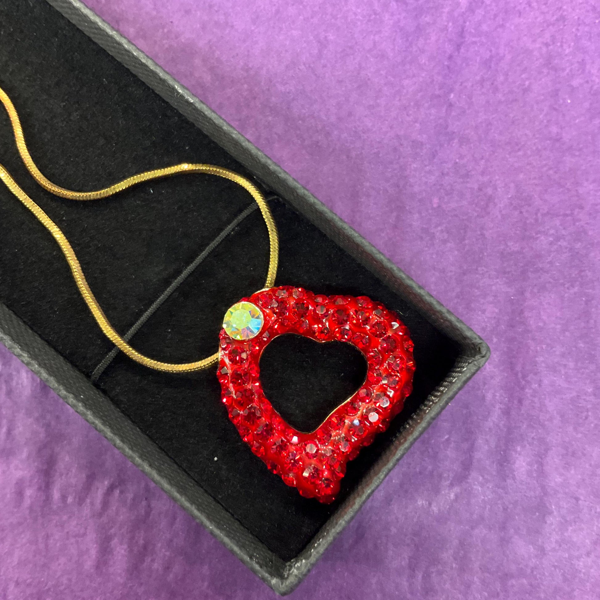 Vintage Butler and Wilson Red Crystal Asymetrical Heart Pendant, gold tone with red rhinestones and Aurora Borealis Crystal
