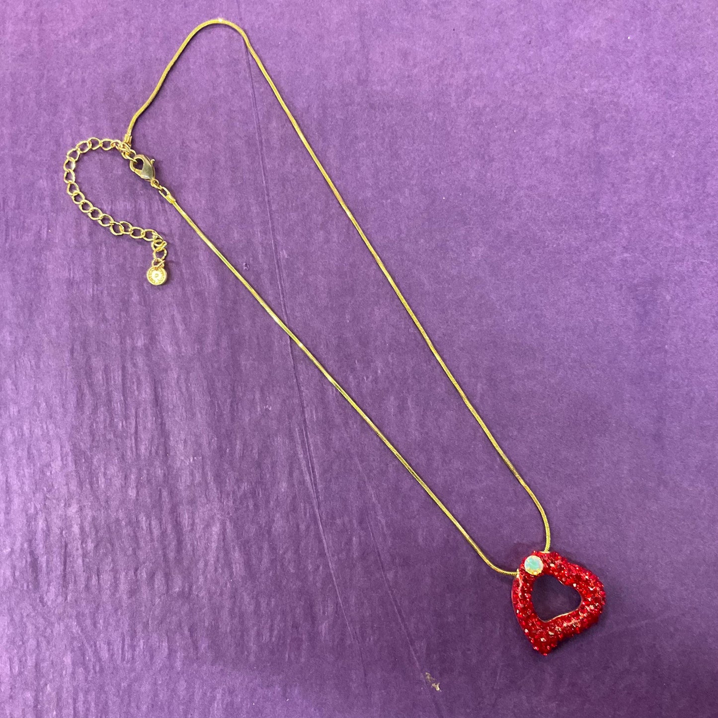 Vintage Butler and Wilson Red Crystal Asymetrical Heart Pendant, gold tone with red rhinestones and Aurora Borealis Crystal