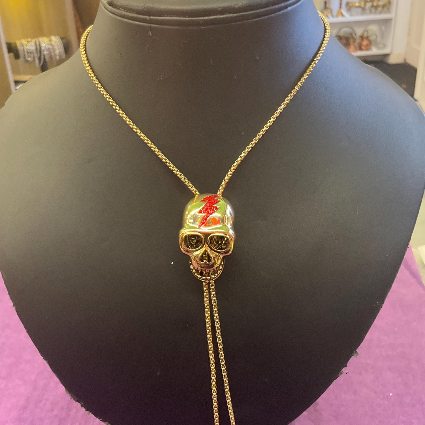 Vintage Butler and Wilson Gold Skull Crystal Lariat Necklace, Gold tone with red Bowie Rhinestone Lightening Flash