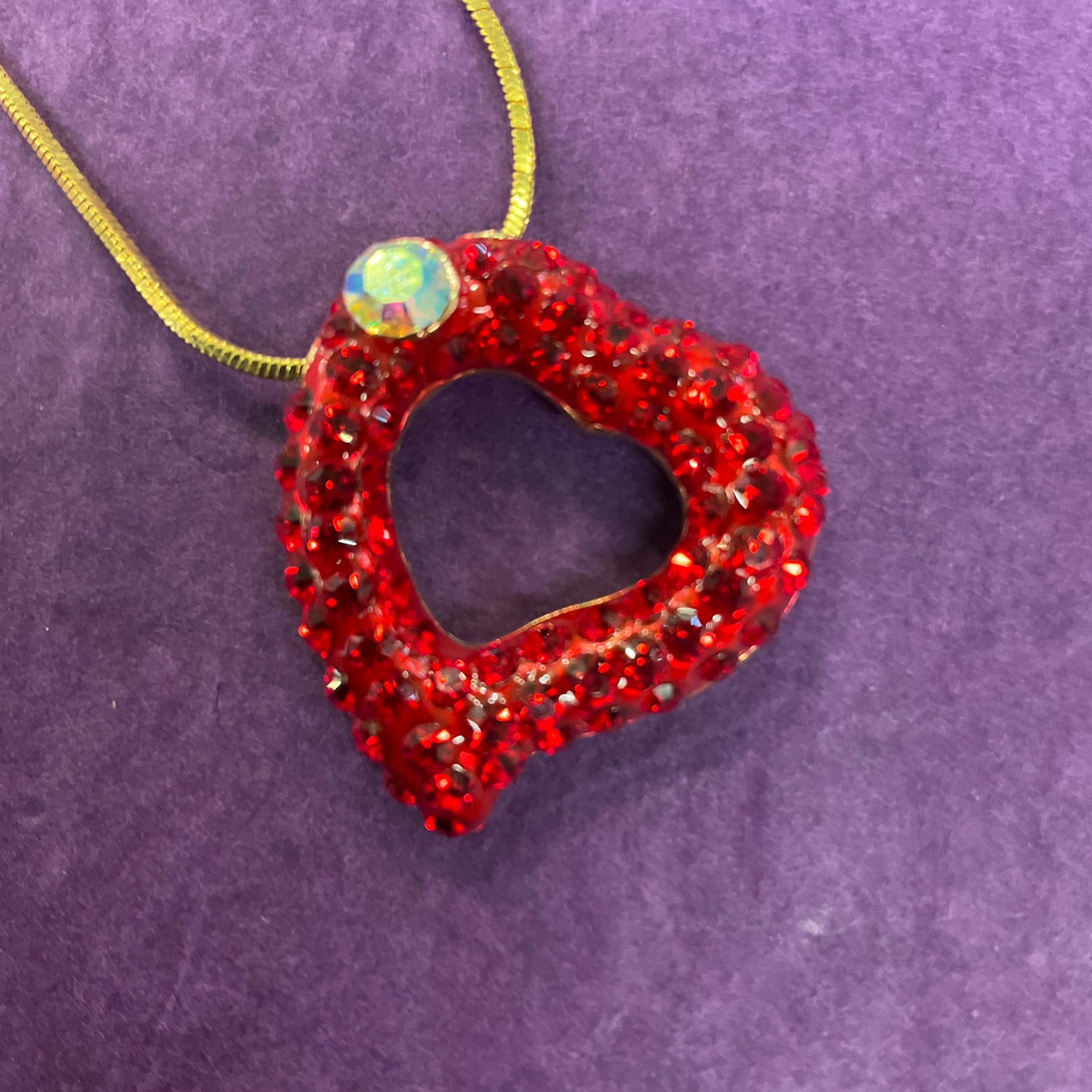 Vintage Butler and Wilson Red Crystal Asymetrical Heart Pendant, gold tone with red rhinestones and Aurora Borealis Crystal