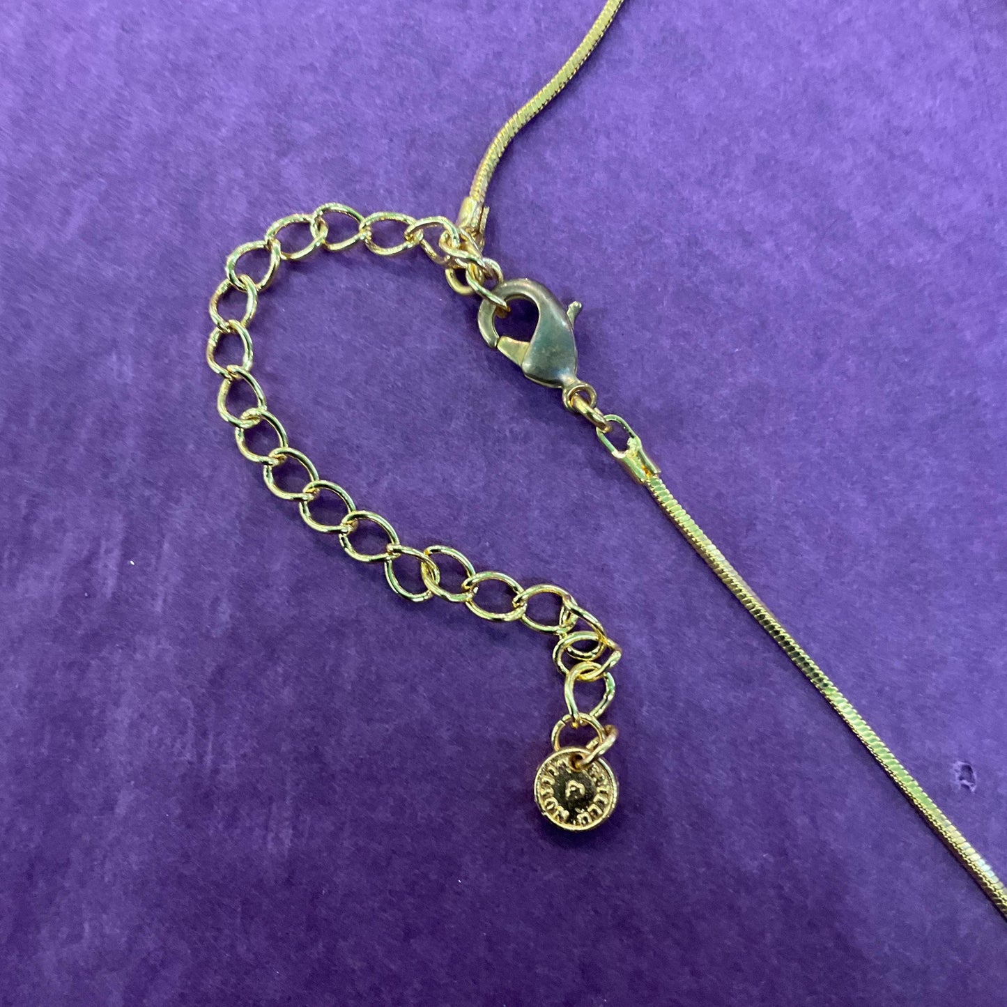 Vintage Butler and Wilson Red Crystal Asymetrical Heart Pendant, gold tone with red rhinestones and Aurora Borealis Crystal