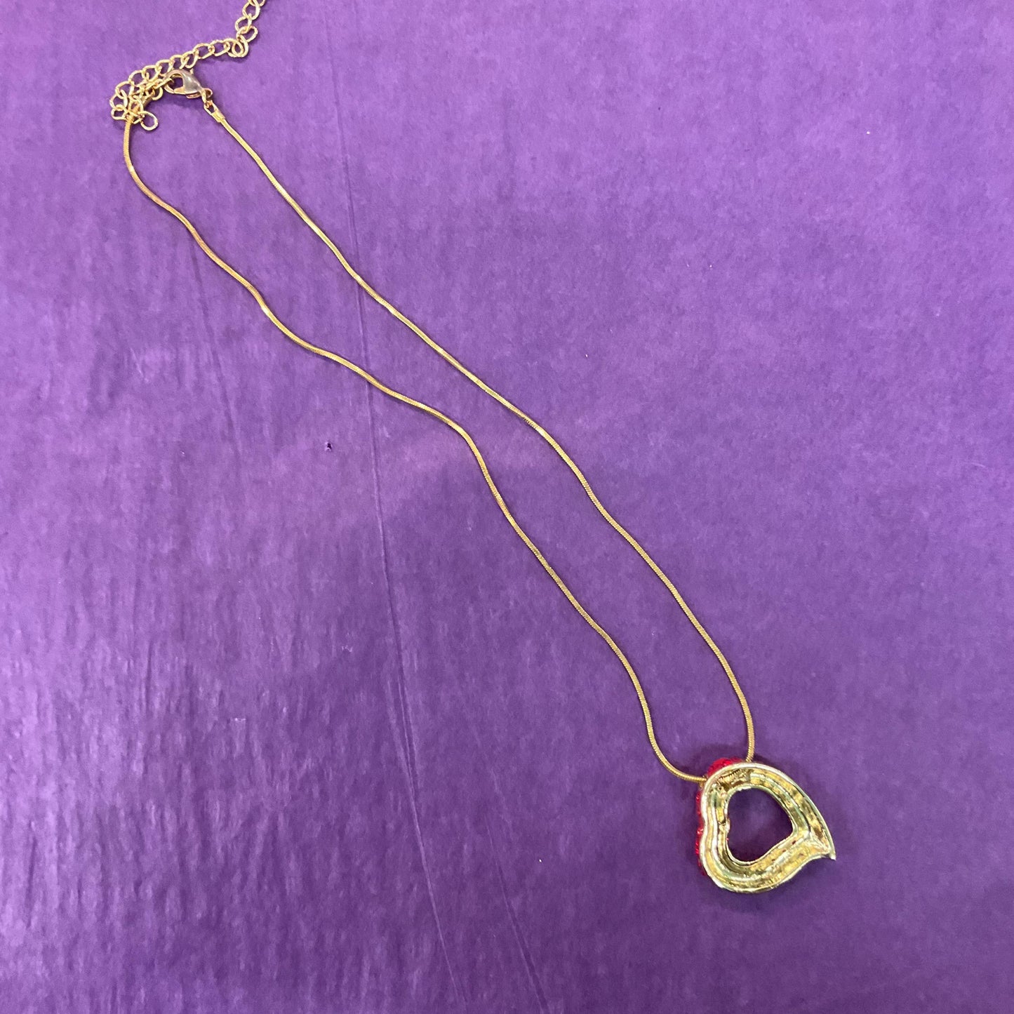 Vintage Butler and Wilson Red Crystal Asymetrical Heart Pendant, gold tone with red rhinestones and Aurora Borealis Crystal