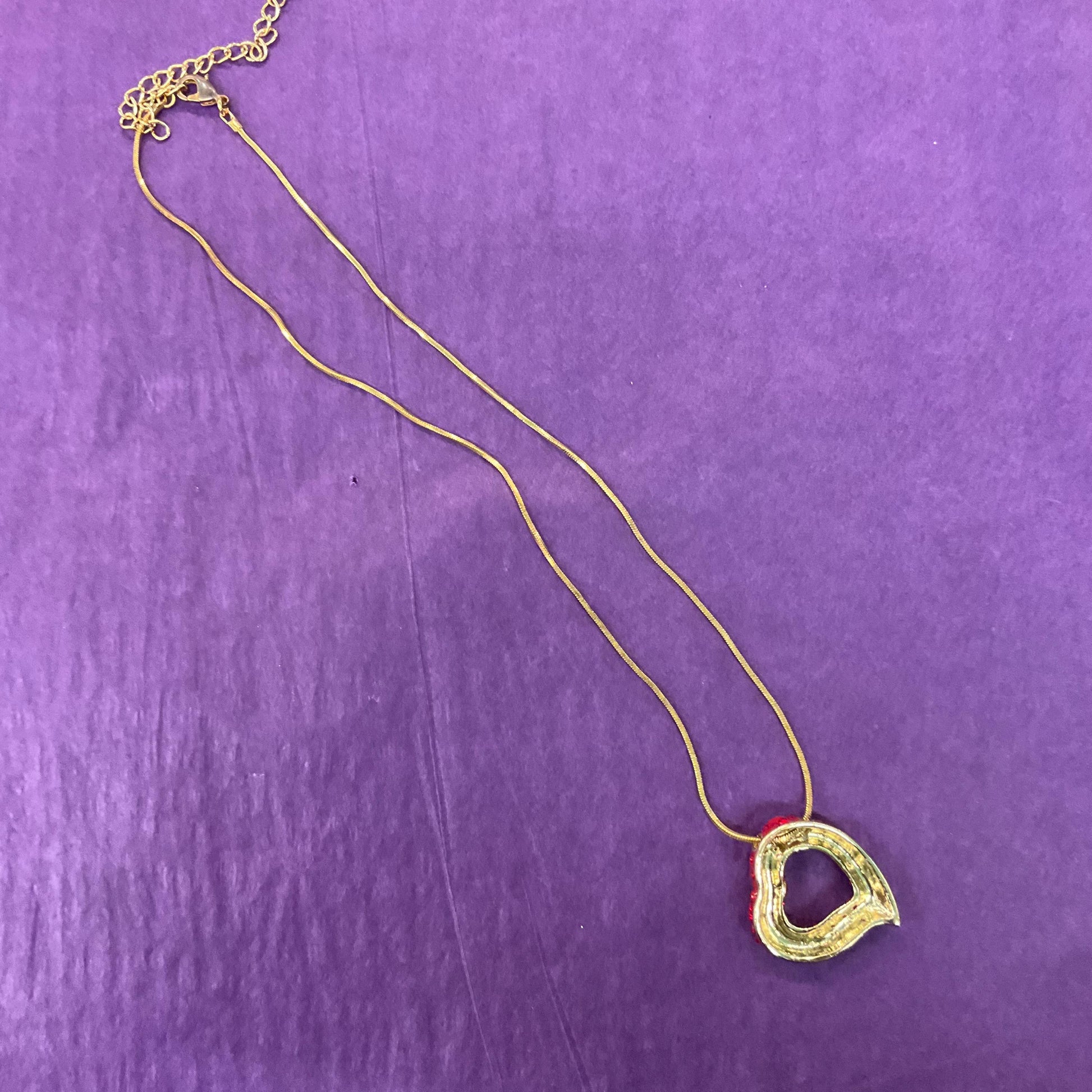 Vintage Butler and Wilson Red Crystal Asymetrical Heart Pendant, gold tone with red rhinestones and Aurora Borealis Crystal