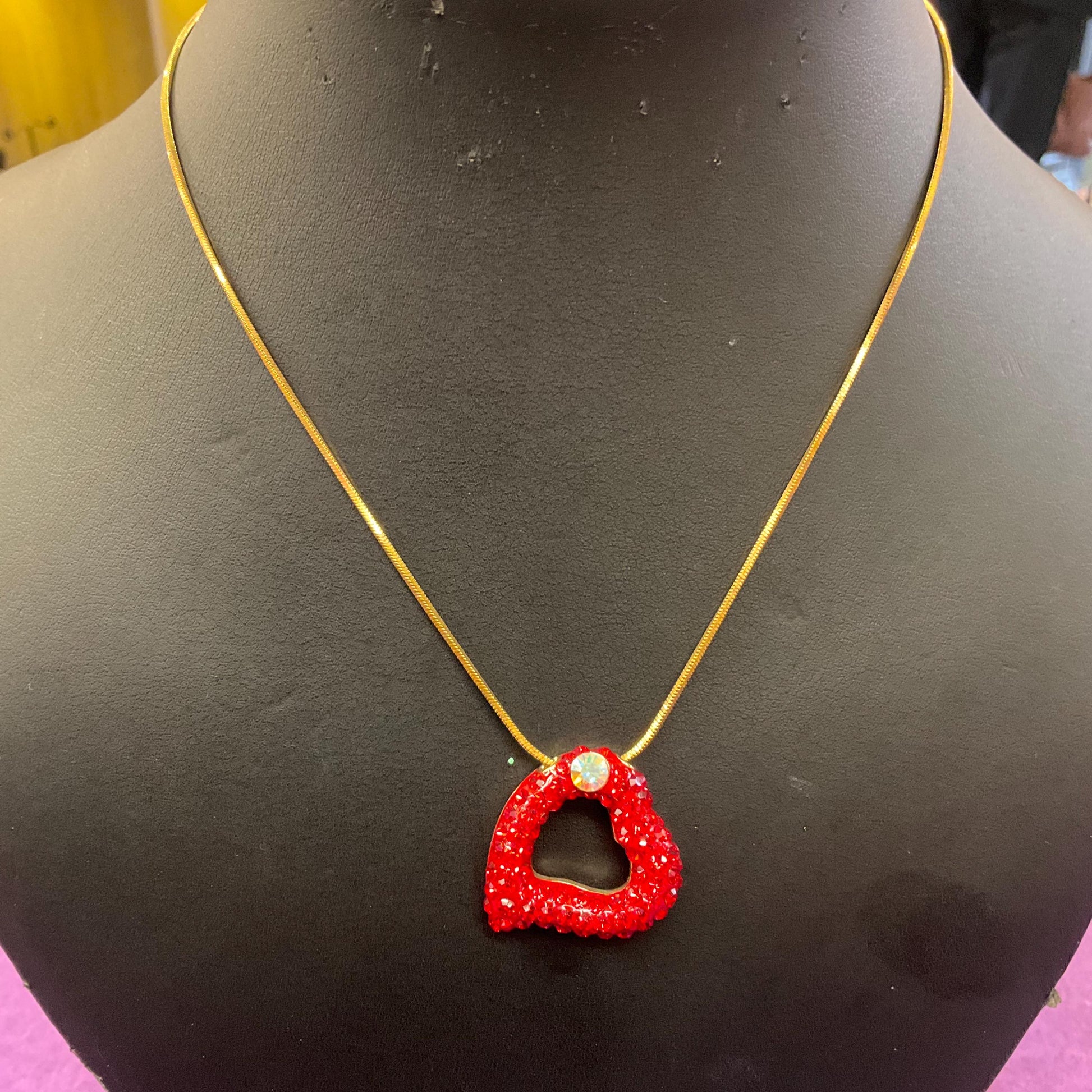 Vintage Butler and Wilson Red Crystal Asymetrical Heart Pendant, gold tone with red rhinestones and Aurora Borealis Crystal