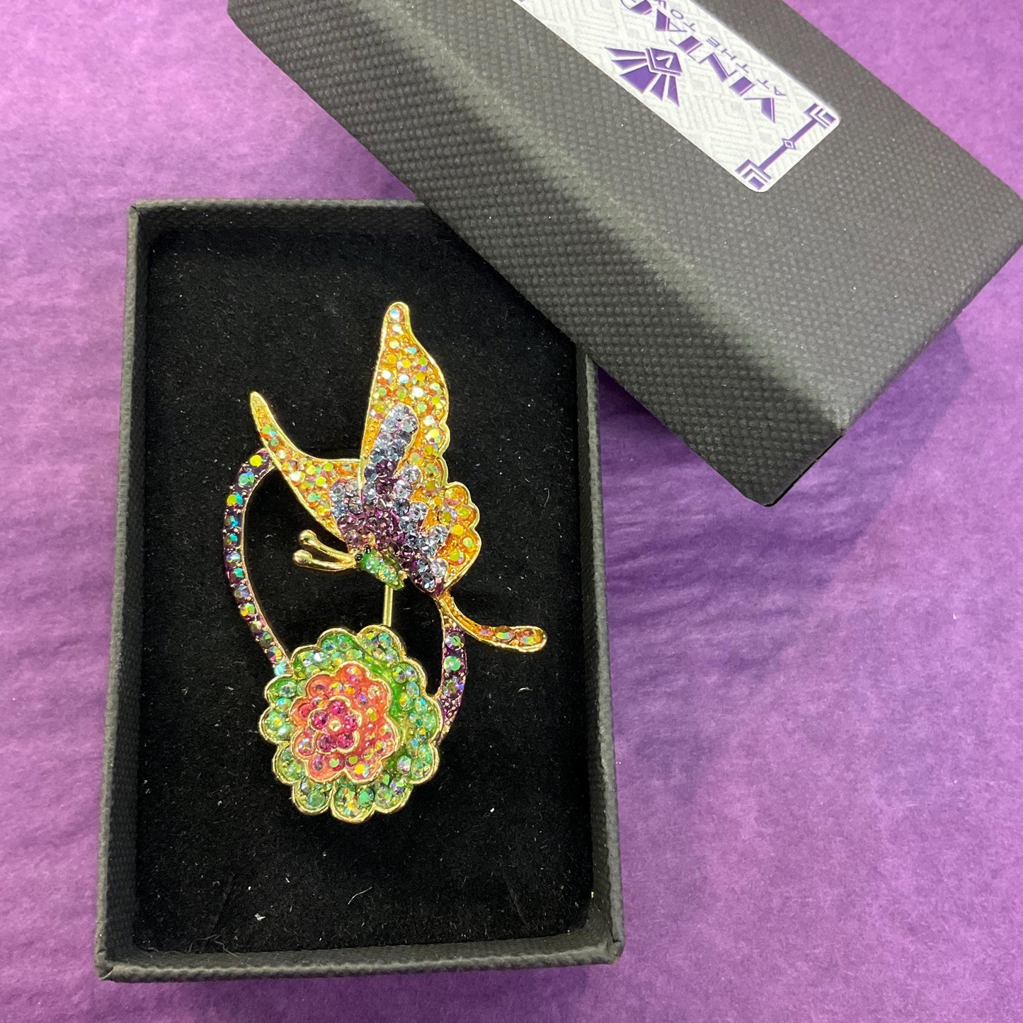 Vintage Butler and Wilson Crystal Rainbow Flower and Butterfly Brooch, gold tone with Borealis rhinestones, signed as new