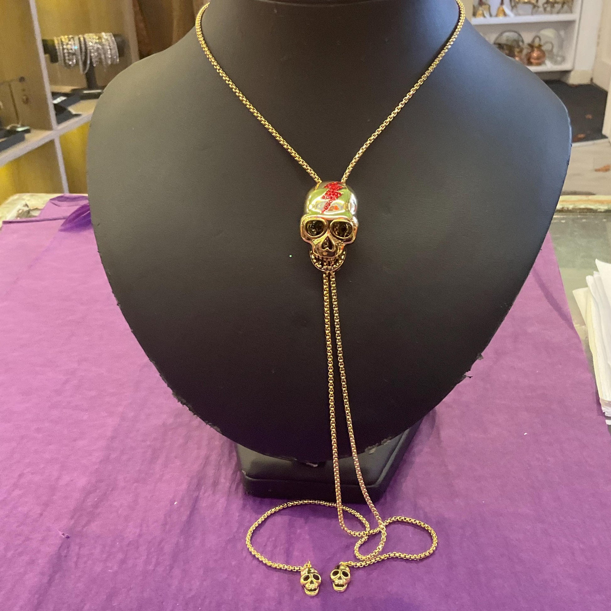 Vintage Butler and Wilson Gold Skull Crystal Lariat Necklace, Gold tone with red Bowie Rhinestone Lightening Flash