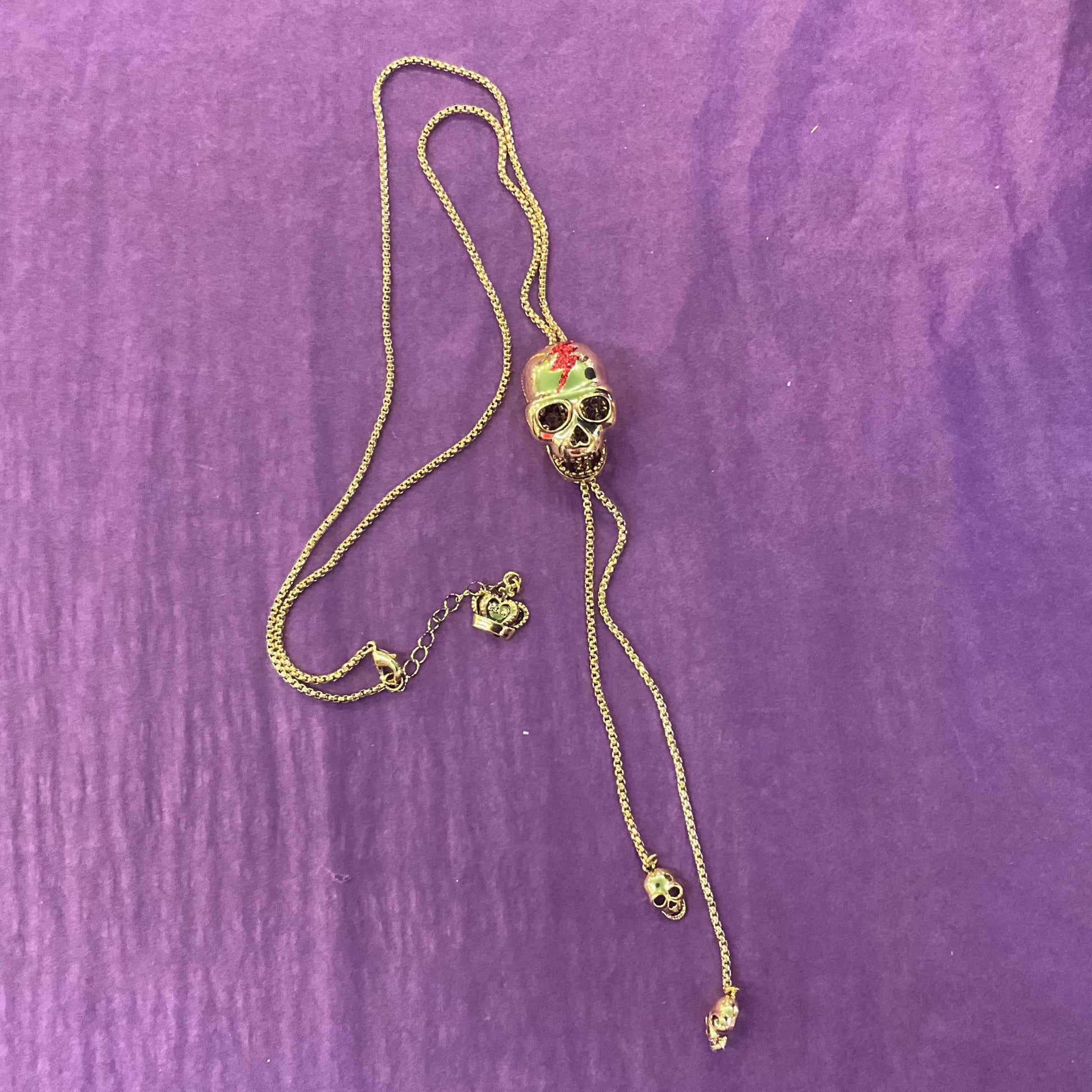 Vintage Butler and Wilson Gold Skull Crystal Lariat Necklace, Gold tone with red Bowie Rhinestone Lightening Flash