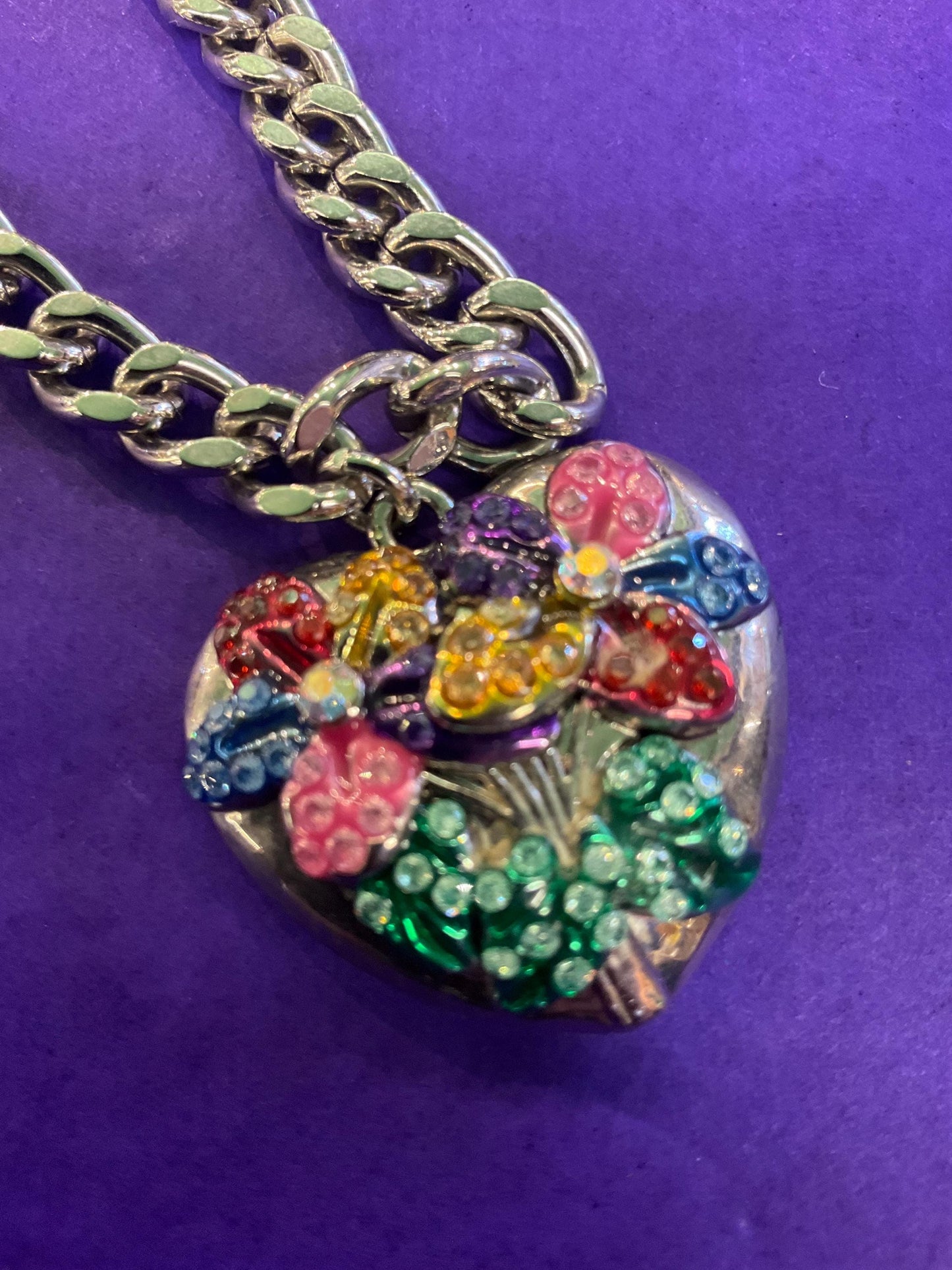 vintage Butler and Wilson floral heart pendant, silver tone metal with multicoloured enamel and borealis rhinestones.