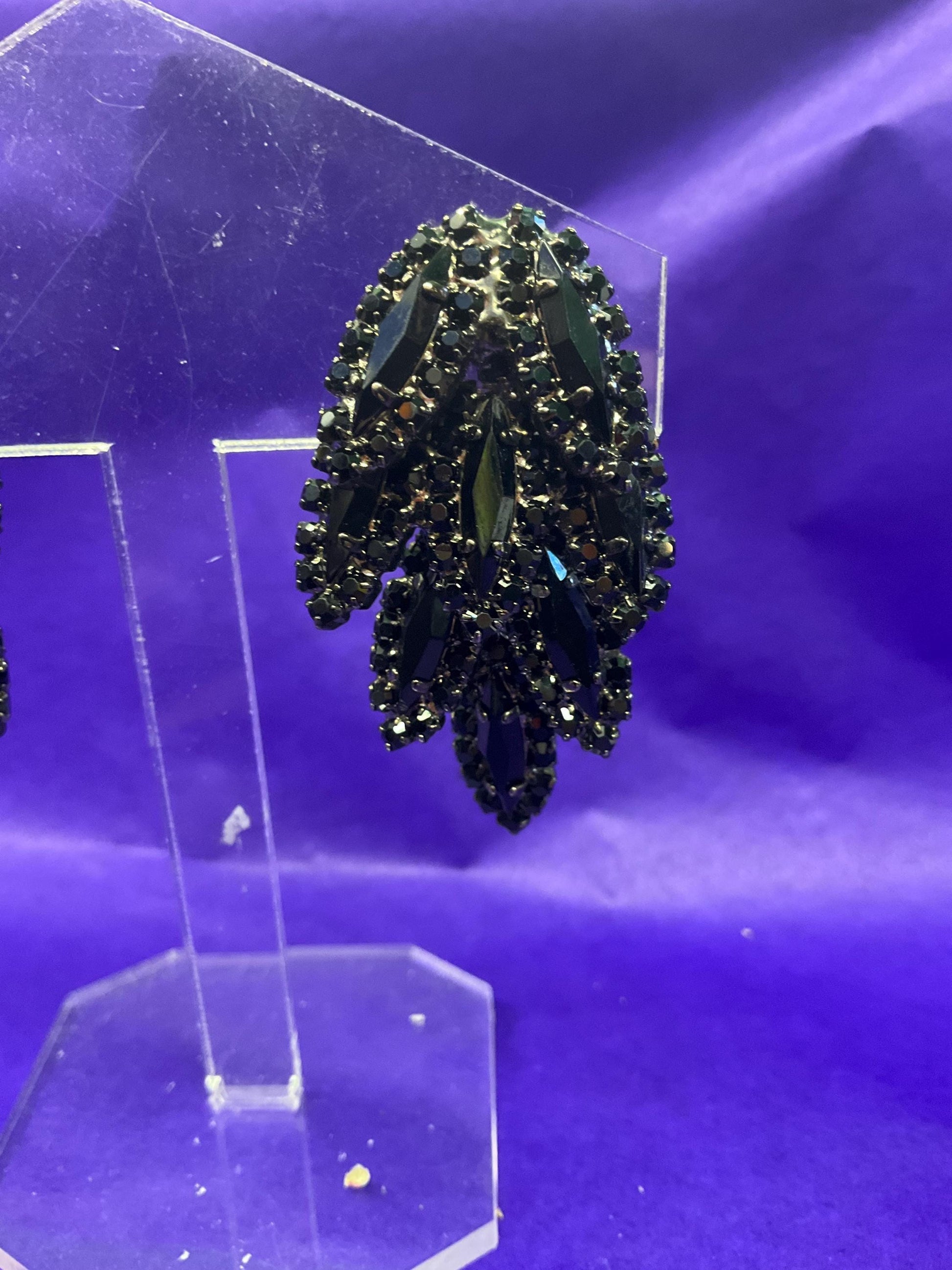 vintage Butler and Wilson large black crystal clip on earrings, hanging articulated leaves of crystal and rhinestones.