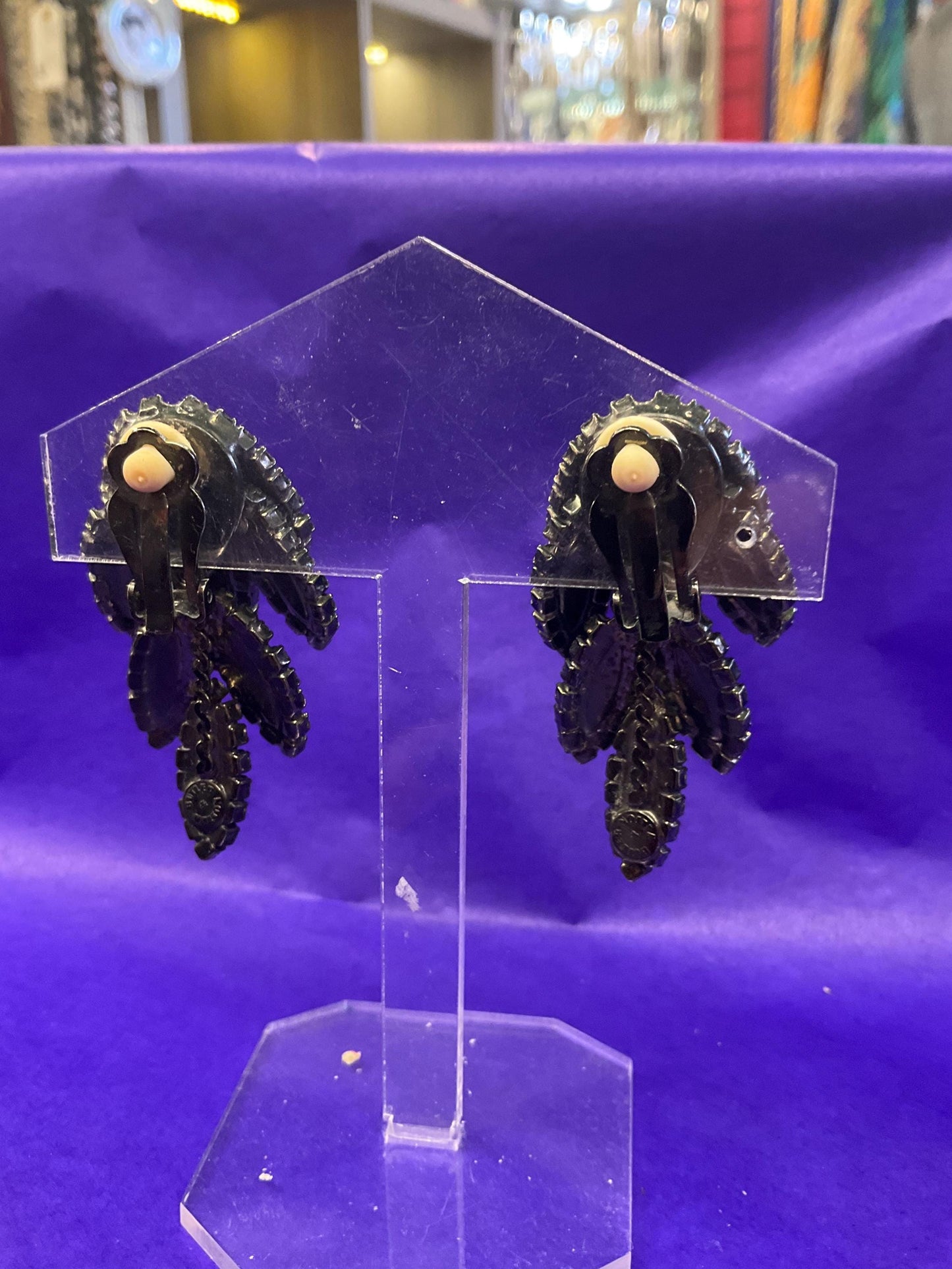vintage Butler and Wilson large black crystal clip on earrings, hanging articulated leaves of crystal and rhinestones.