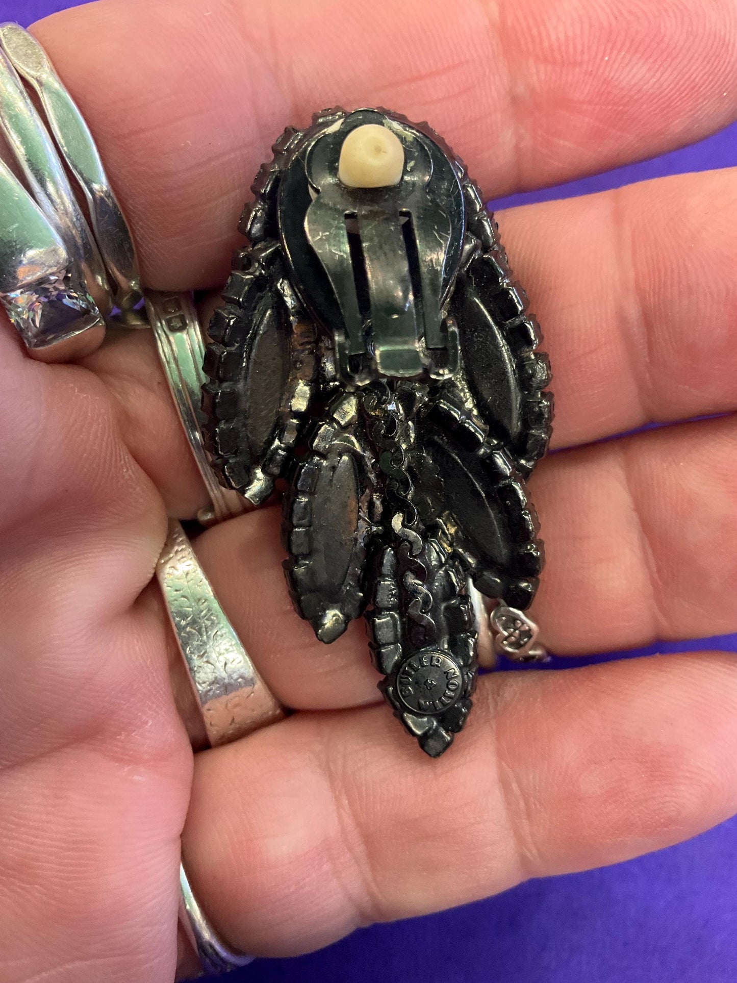 vintage Butler and Wilson large black crystal clip on earrings, hanging articulated leaves of crystal and rhinestones.
