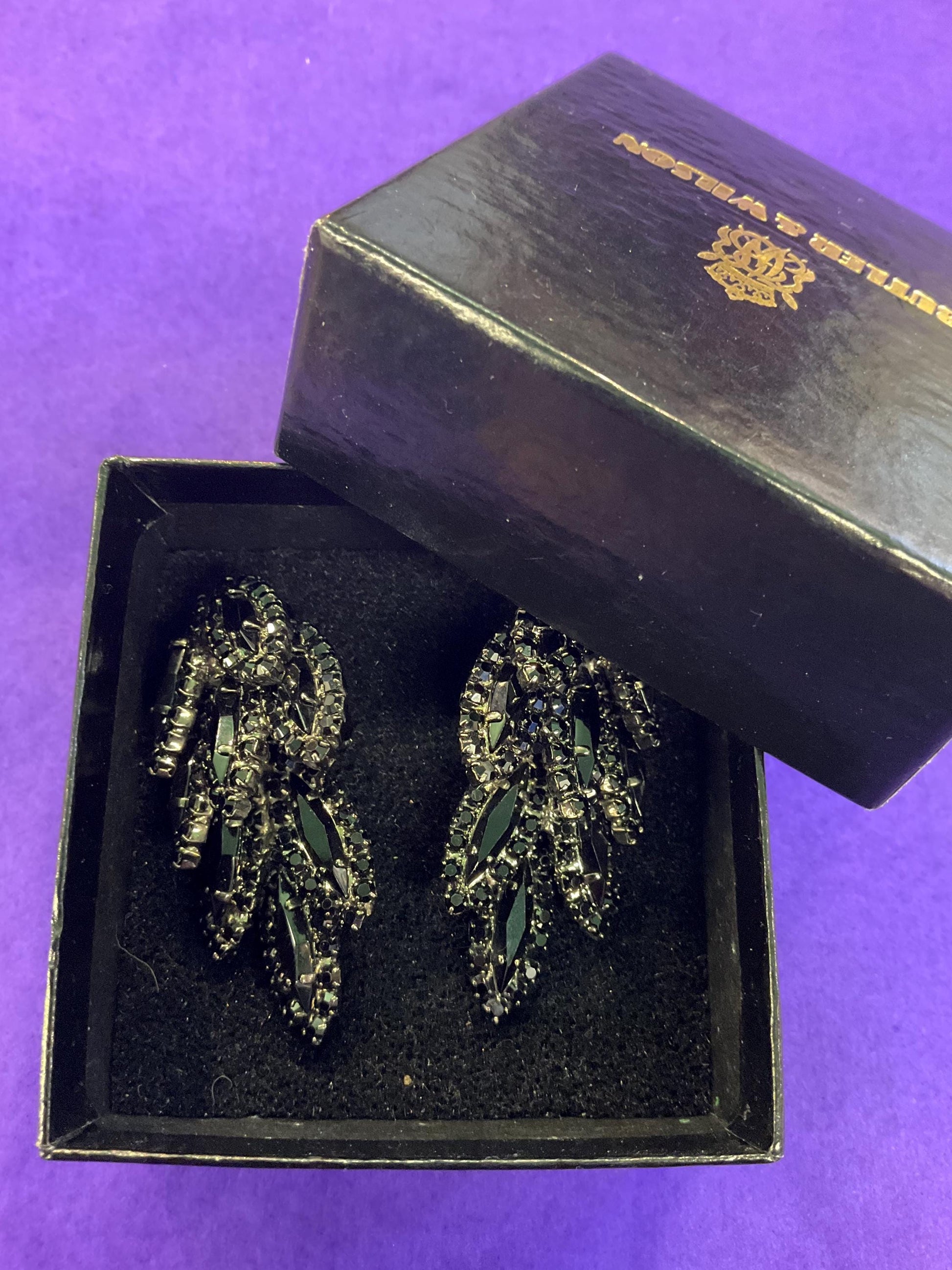 vintage Butler and Wilson large black crystal clip on earrings, hanging articulated leaves of crystal and rhinestones.