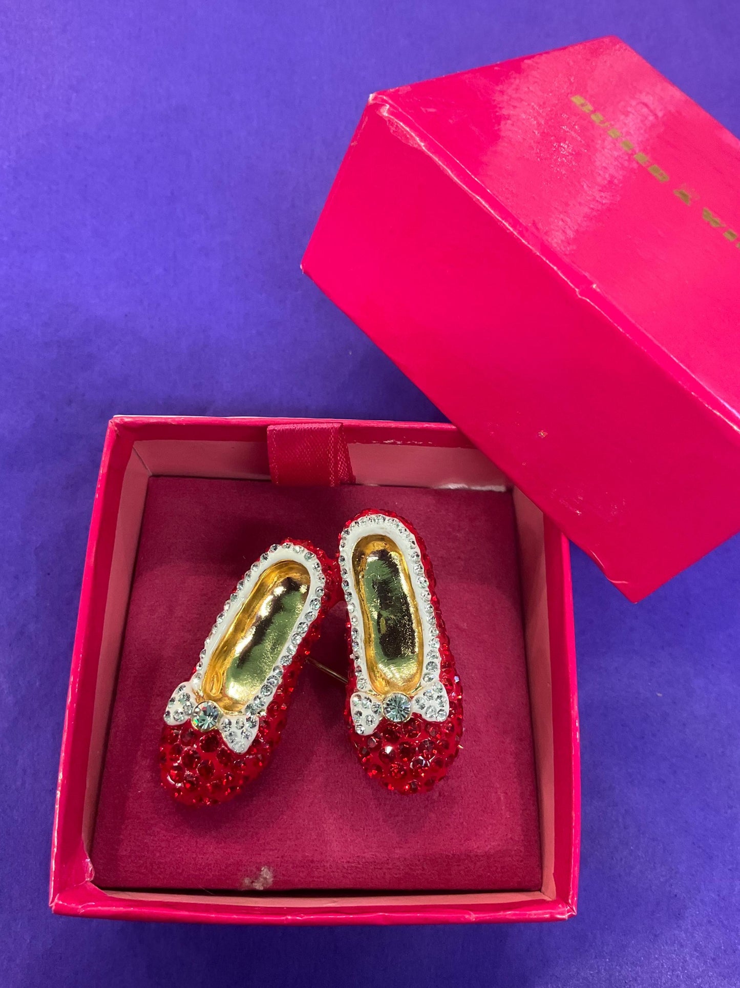 Vintage Butler and Wilson Crystal Dorothy Shoes large brooch in gold tone metal, red and silver rhinestones