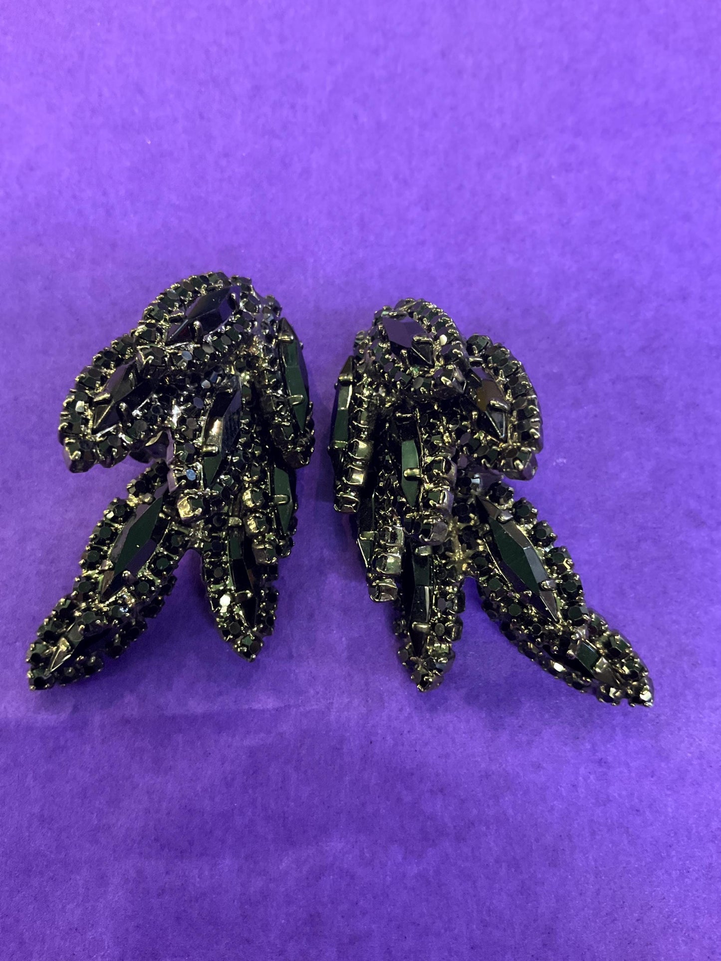 vintage Butler and Wilson large black crystal clip on earrings, hanging articulated leaves of crystal and rhinestones.
