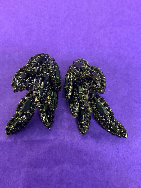 vintage Butler and Wilson large black crystal clip on earrings, hanging articulated leaves of crystal and rhinestones.