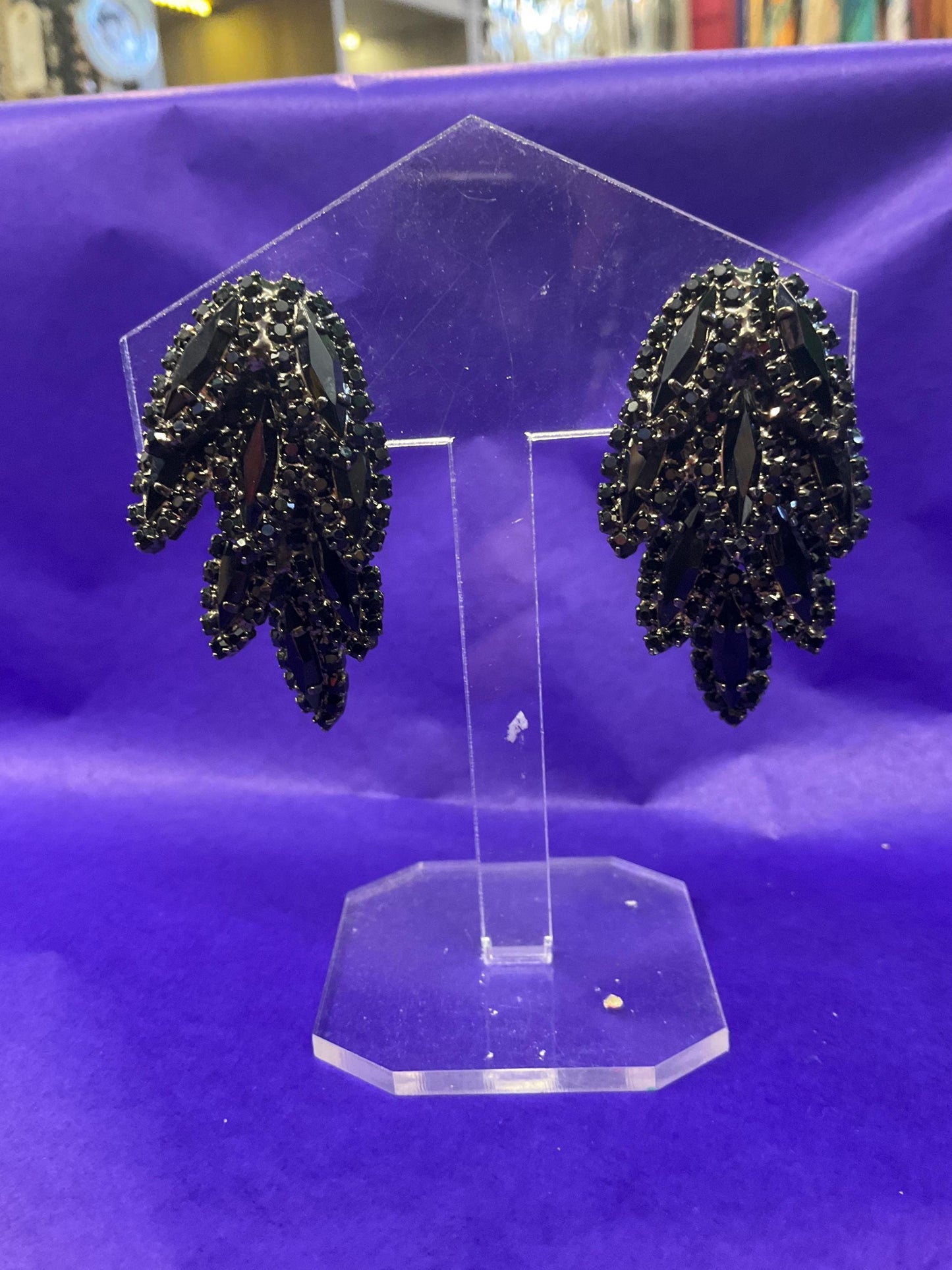 vintage Butler and Wilson large black crystal clip on earrings, hanging articulated leaves of crystal and rhinestones.