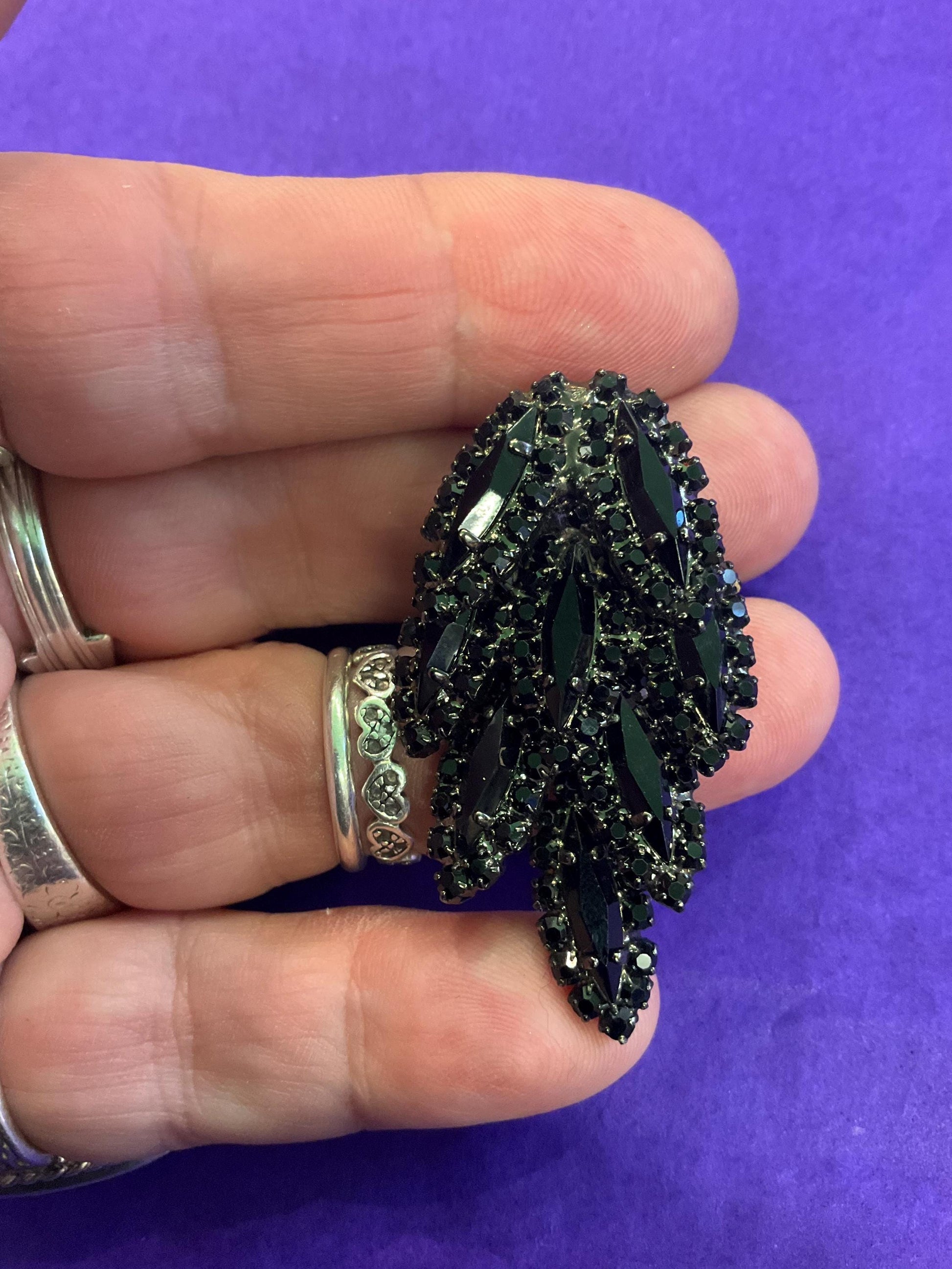 vintage Butler and Wilson large black crystal clip on earrings, hanging articulated leaves of crystal and rhinestones.