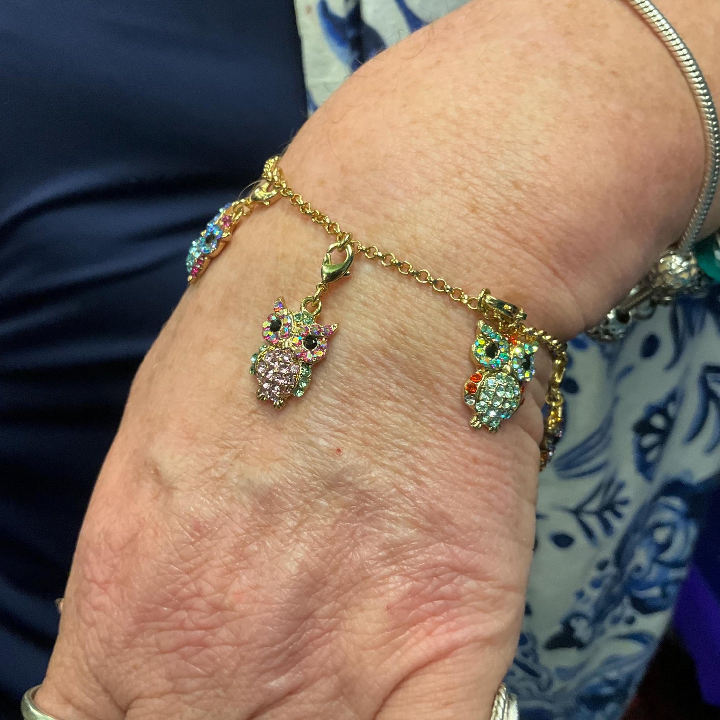 Vintage Butler and Wilson Rainbow Crystal Owl Charm Bracelet, gold tone with multicolored pastel borealis rhinestones