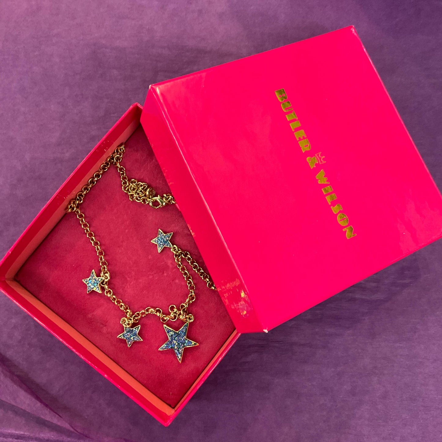 Vintage Butler and Wilson Blue Crystal Star Necklace, gold tone with blue borealis rhinestones