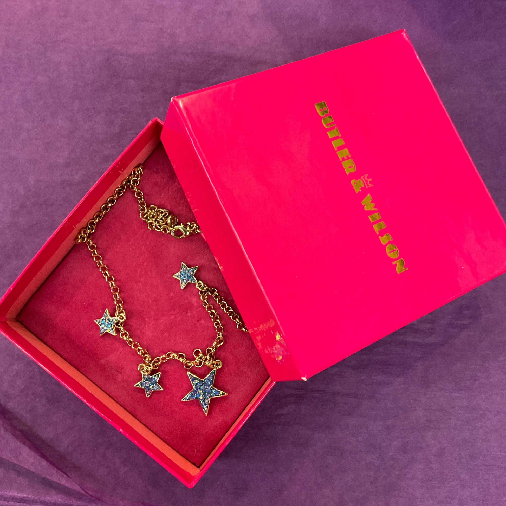 Vintage Butler and Wilson Blue Crystal Star Necklace, gold tone with blue borealis rhinestones
