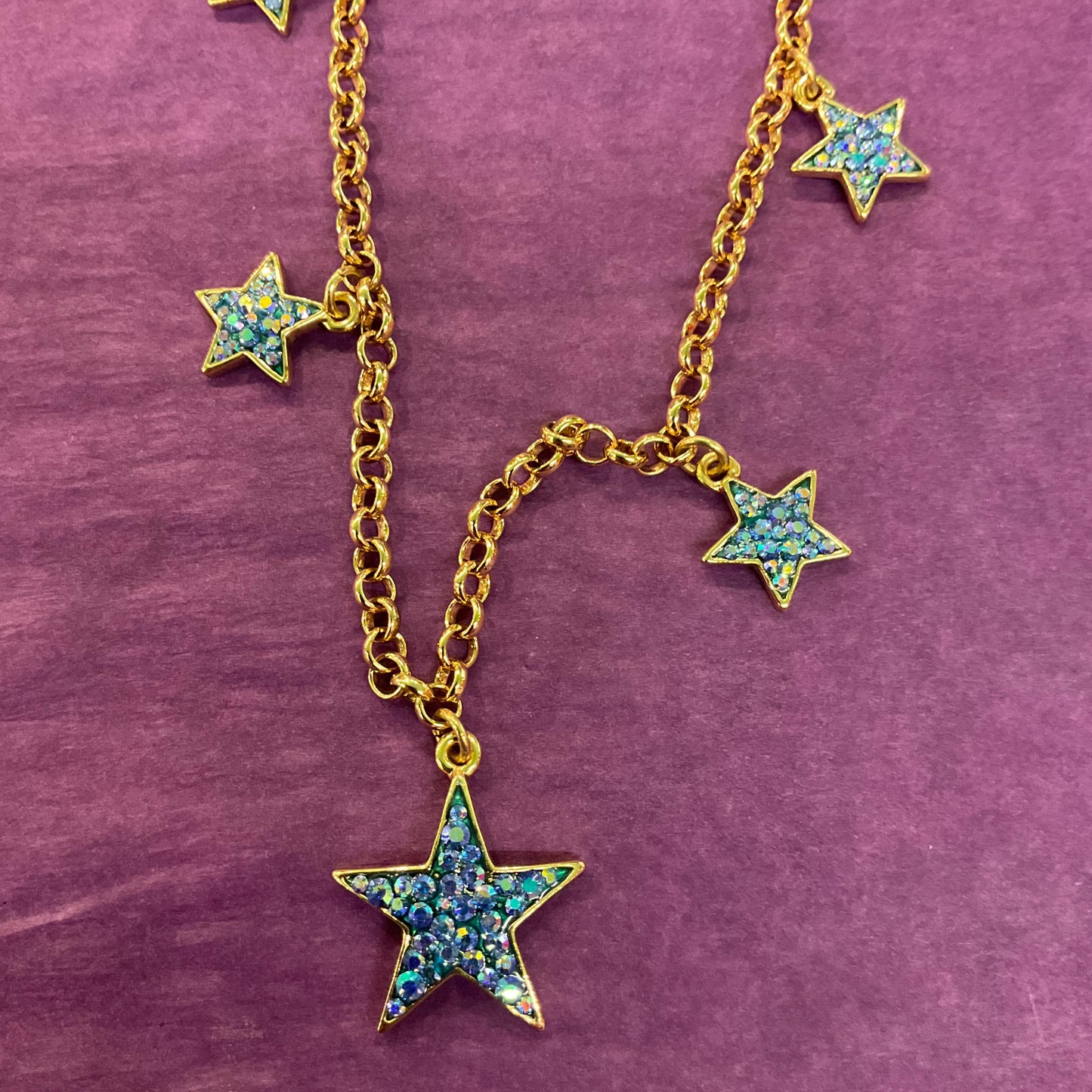 Vintage Butler and Wilson Blue Crystal Star Necklace, gold tone with blue borealis rhinestones
